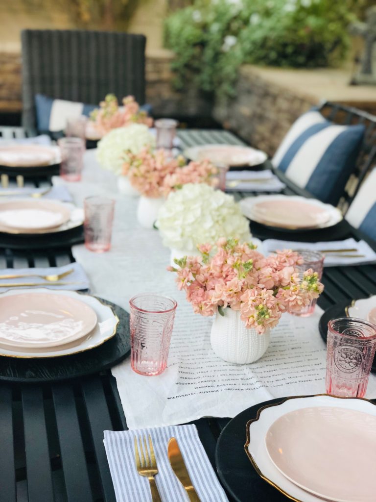 white and pink poolside table