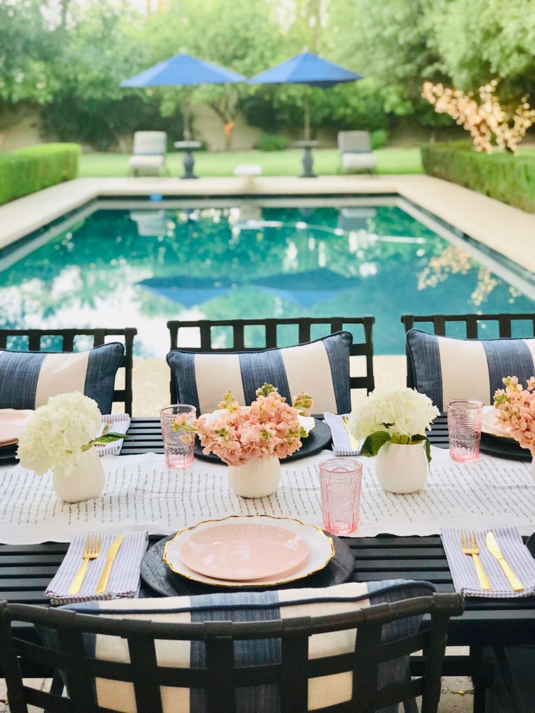 white and pink poolside table