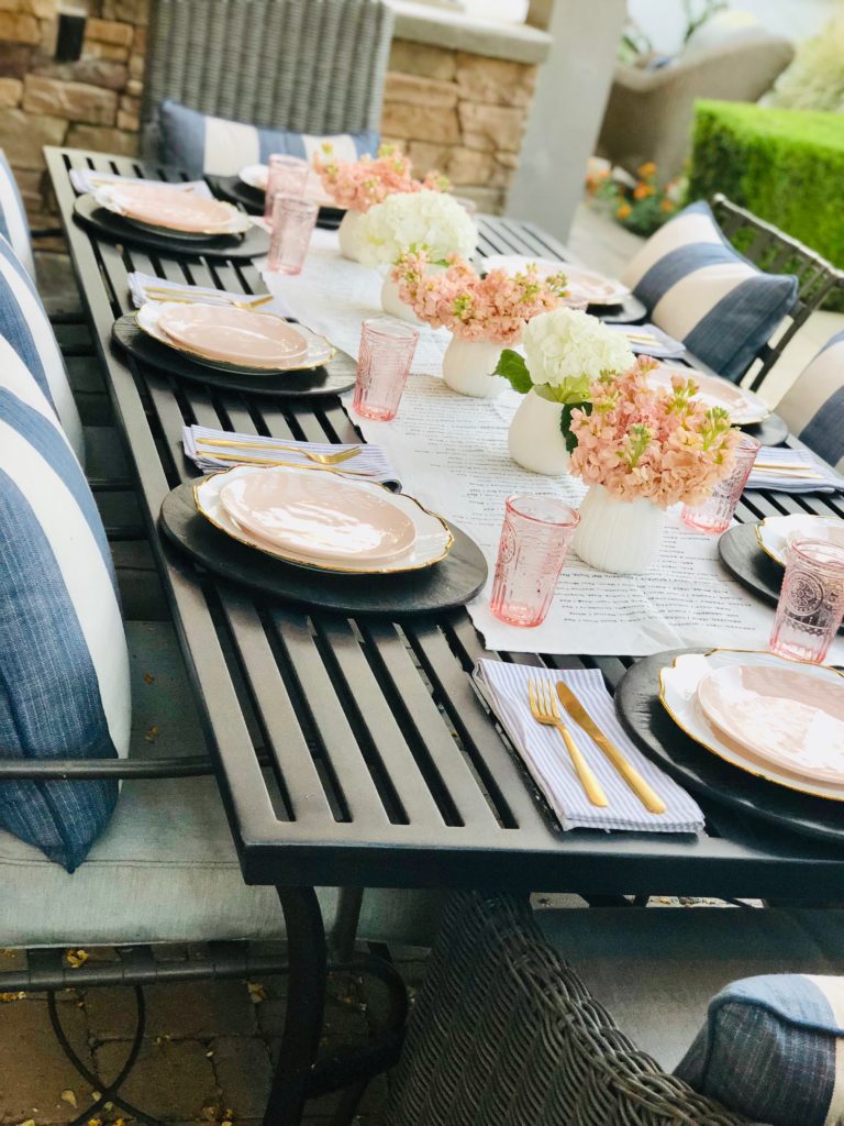 white and pink poolside table