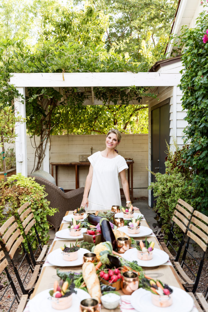 outdoor farmer's market dinner party with host